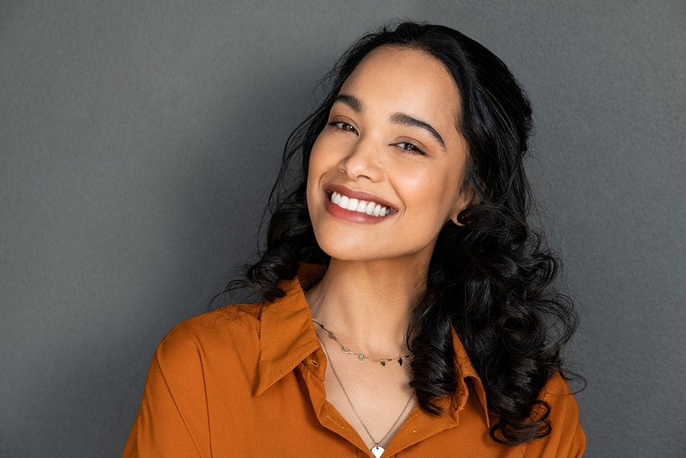 Close-up of Latina woman's beautiful white teeth, which she takes care of with regular dental checkups.
